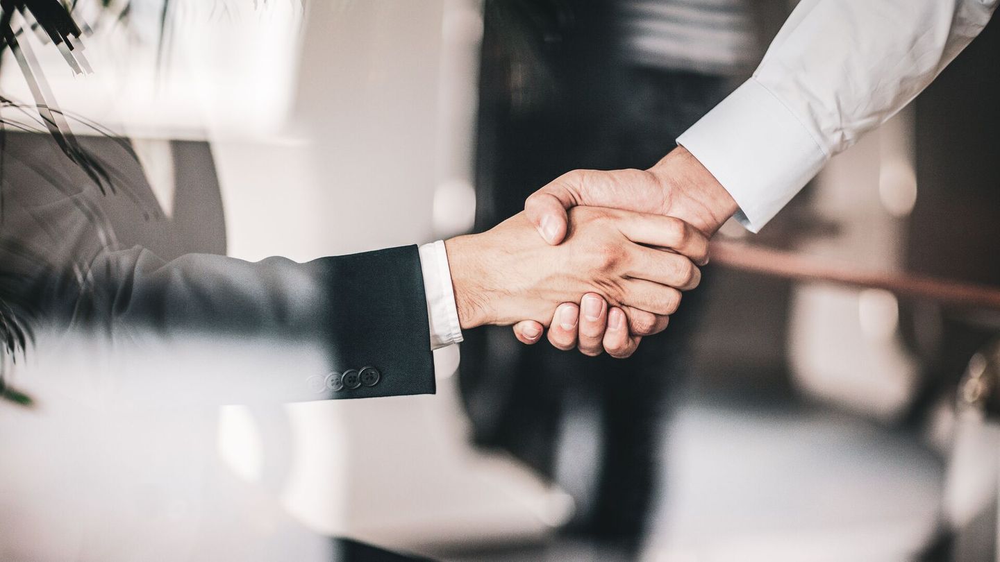 Schaeffler business handshake in the office